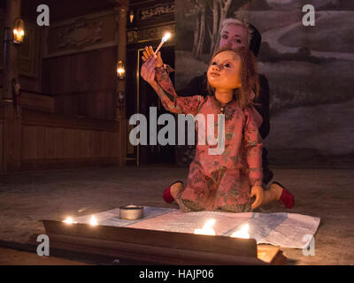 London, UK. 30 November 2016. Puppeteer Edie Edmundson performing with The Little Matchgirl. The Sam Wanamaker Playhouse presents The Little Matchgirl and Other Happier Tales from the stories of Hans Christian Andersen. Written an co-adapted by Joel Horwood, direction and co-adapted by Emma Rice. Performances from 24 November 2016 to 22 January 2017. Performers: Paul Hunter, Japjit Kaur, Akiya Henry, Bettrys Jones, Kyle Lima, Jack Shalloo and puppeteer Edie Edmundson. Stock Photo