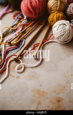 Close up of assorted yarn and wooden needles Stock Photo