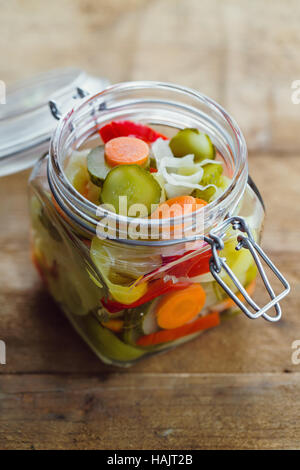 Pickled vegetables in glass jar Stock Photo