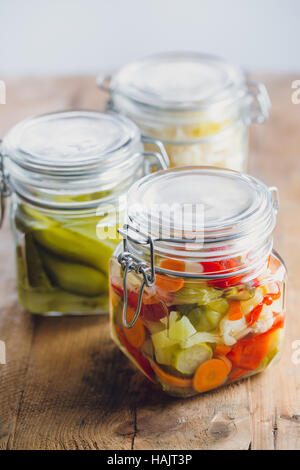 Pickled vegetables in glass jars Stock Photo