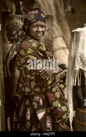 Mali, West Africa - January 25, 1992: Dogon village and typical mud buildings with  barns for cereals and Peul Fulani popolations Stock Photo