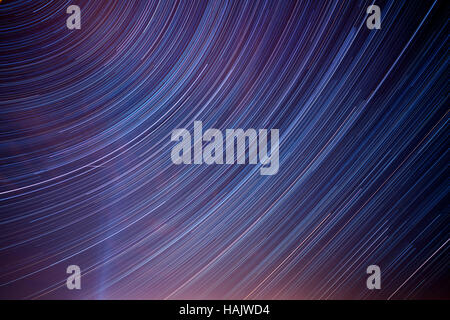 star trails on blue night sky Stock Photo