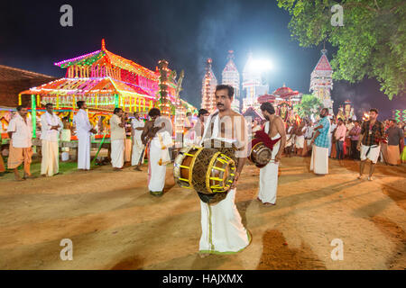 A Thakil (traditional percussion instrument) performer at Ezhamkulam temple festival, Kerala, India Stock Photo