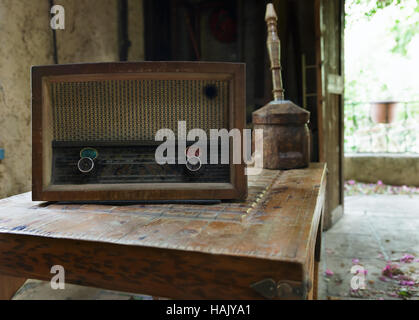 dusty old radio on a wooden table Stock Photo