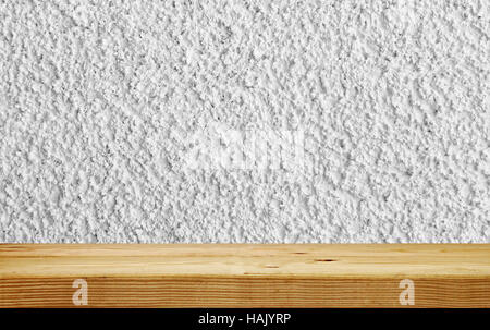 empty shelf on white plaster wall Stock Photo