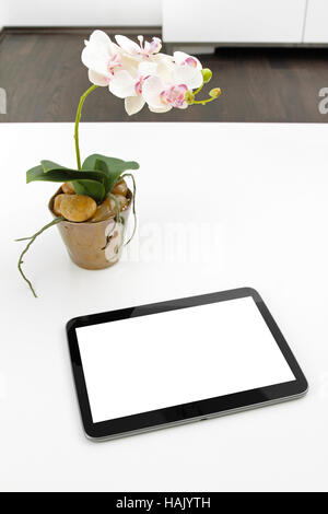 blank tablet on white table in the office Stock Photo