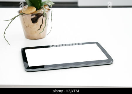 blank digital tablet on the table Stock Photo