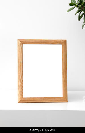 blank photo frame on table in the room Stock Photo