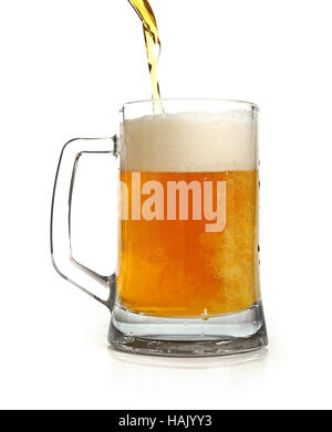 pouring beer in mug isolated on white Stock Photo