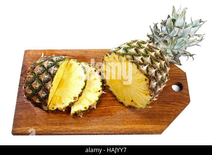 sliced pineapple on wooden board isolated on white Stock Photo