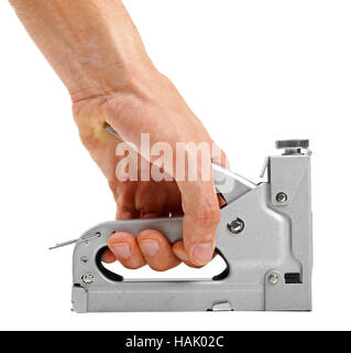 hand with construction stapler isolated on white Stock Photo