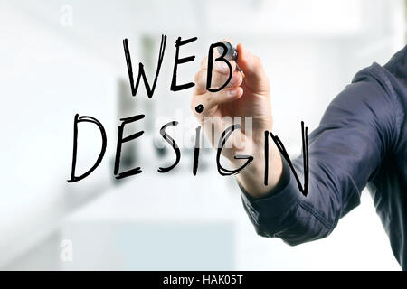 hand writing web design with black marker Stock Photo