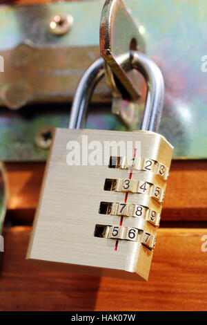 closed padlock on a wooden door Stock Photo