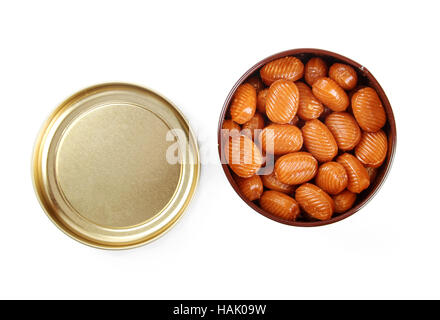 caramel candy in metal jar isolated on white Stock Photo