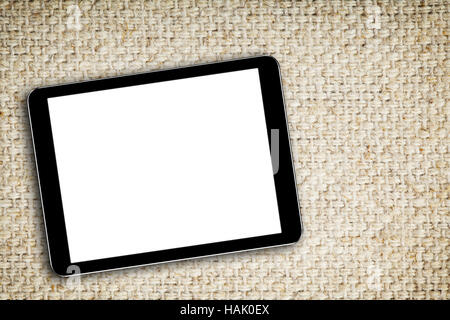 blank digital tablet on fabric background Stock Photo
