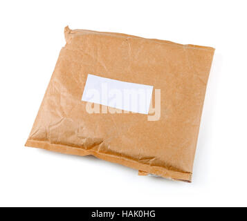 small paper post parcel with blank label isolated on white Stock Photo