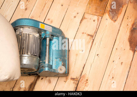 old plank floor and grinding machine with copy space Stock Photo