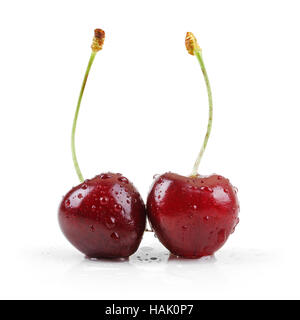 two wet cherries isolated on white Stock Photo