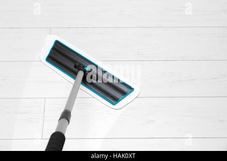 house cleaning - mop washing white laminate floor Stock Photo