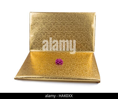 laptop wrapped in golden gift paper isolated on white Stock Photo