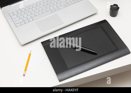 digital drawing tablet and laptop on the table Stock Photo