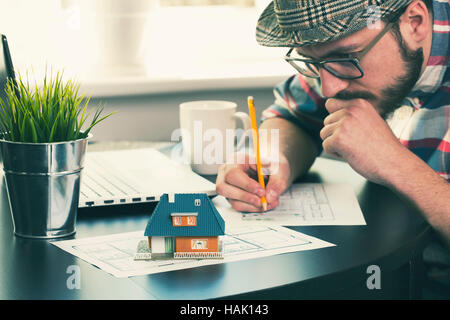 architect, construction engineer working on new house project at office Stock Photo