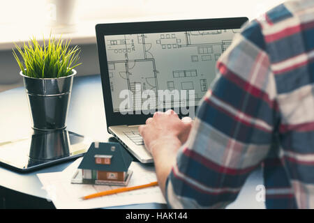 architect, interior designer occupation - man working on new house project at office Stock Photo