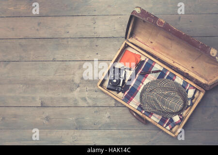 opened vintage suitcases with clothes and accessories. copy space Stock Photo