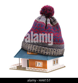 home insulation or insurance concept. hat on house roof isolated on white Stock Photo