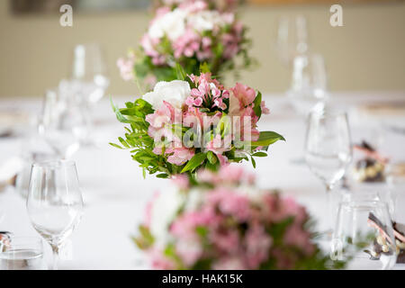 wedding banquet table flower decoration in a restaurant Stock Photo