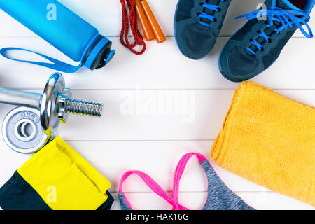 top view with fitness equipment on white wooden background Stock Photo