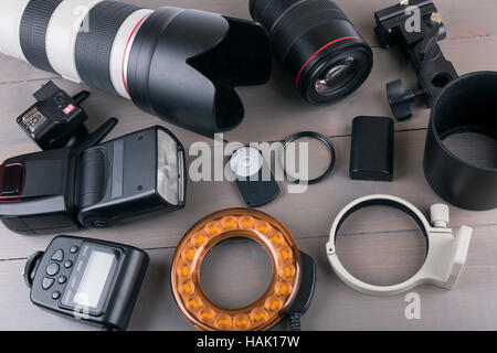 camera photo lenses and equipment on wooden background Stock Photo