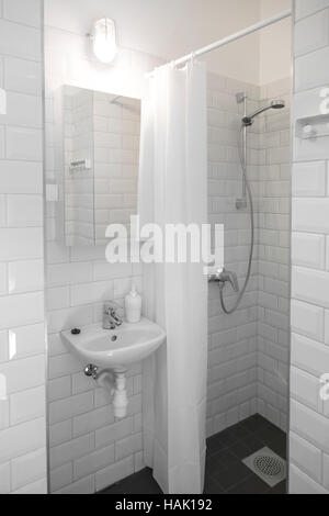 small, compact, white bathroom interior Stock Photo