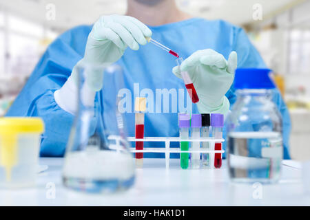 chemist analyzing liquid samples in a laboratory Stock Photo