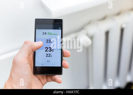 modern house heating temperature control system with smart phone Stock Photo