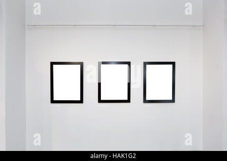 exhibition gallery interior with empty frames on wall Stock Photo