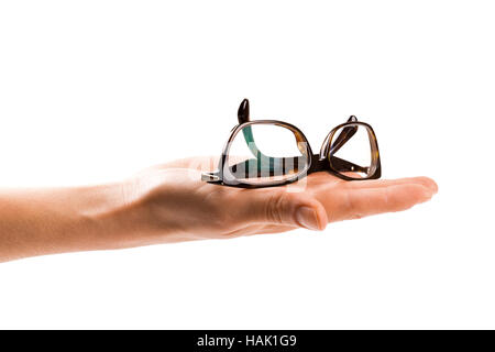 glasses on womans hand isolated on white background Stock Photo