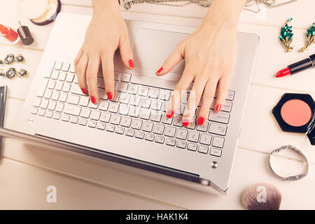 woman writing fashion blog. laptop and accessories on the table Stock Photo