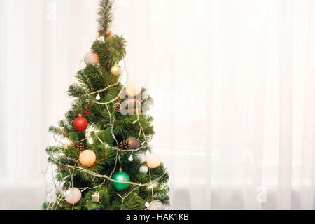 christmas tree standing in the room at home with copy space Stock Photo