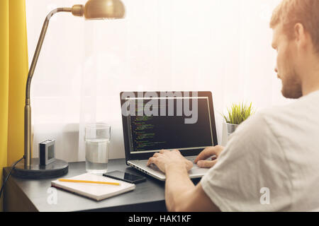 freelance programmer working from home Stock Photo