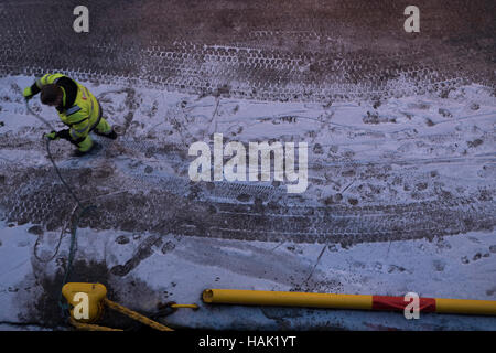 Winter abstract image of dock worker in Hammerfest harbour, northern Norway. Stock Photo