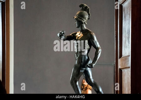 A tourist watching antique statue at Uffizi Gallery , Florence, capital of Tuscany region, Italy Stock Photo