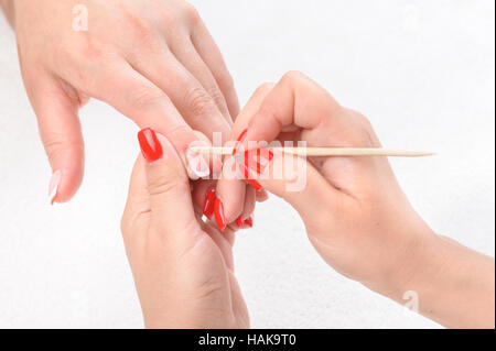 Cuticles care with cuticle pusher Stock Photo