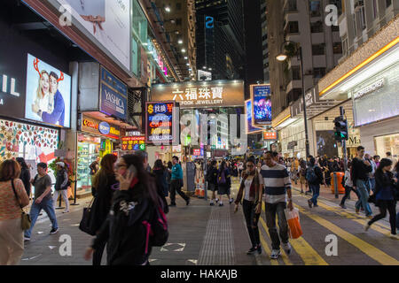 Hong Kong crowded street of shopping district at night Stock Photo