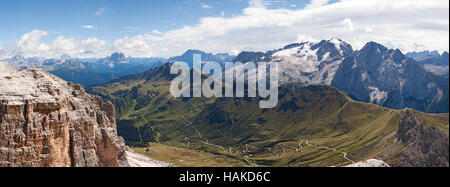 Panoramic landscape of the valley Passo Pordoi from the Canazei ski station, Dolomites, South Tyrol, Italy. Stock Photo