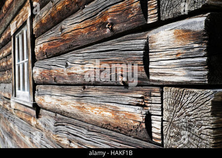 Close-up of weathered logs on traditional wooden building at Barkerville Historic Town in British Columbia, Canada Stock Photo