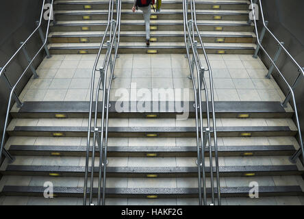 Train station stairs with metal railings at Paddington Station in London, England Stock Photo