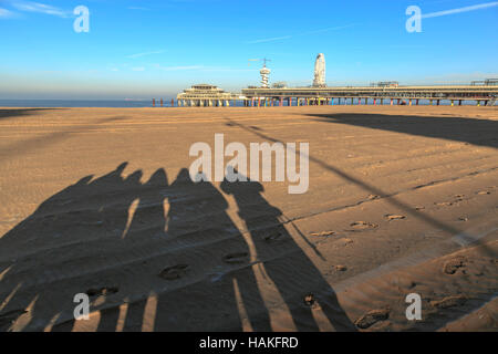 Alternative group photo of people, who take their own portrait with view on the Pier in Scheveningen on a clear frosty morning. Stock Photo