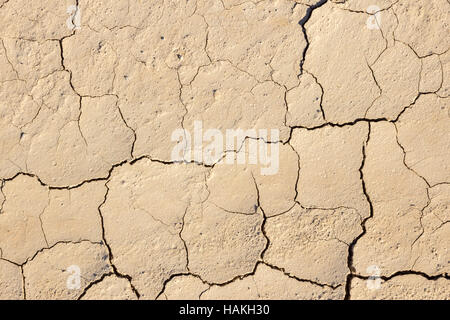Surface of cracking dried brown mud Stock Photo