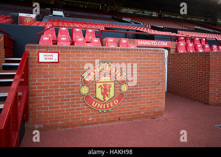 Manchester United stadium dugout   job staff soccer football sports complex arena working repairing stadium old trafford home team managers seat staff Stock Photo